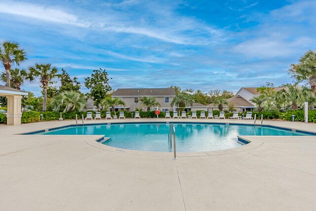 view of swimming pool with a patio area