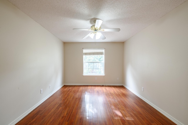 unfurnished room with ceiling fan, hardwood / wood-style floors, and a textured ceiling