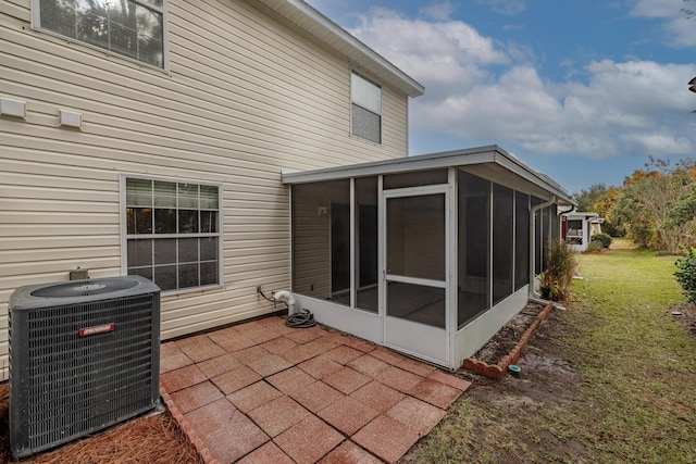 exterior space featuring central AC and a sunroom