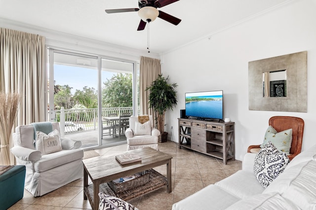 living room with crown molding, ceiling fan, and light tile patterned floors