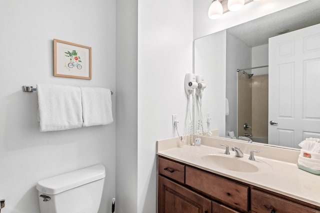 full bathroom featuring toilet, bathing tub / shower combination, and vanity