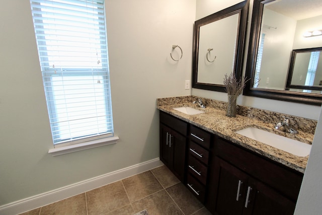 bathroom featuring tile patterned floors and vanity