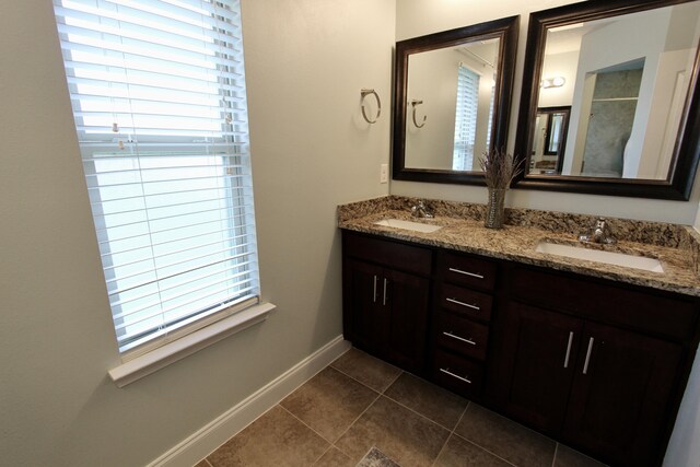 bathroom with tile patterned flooring and vanity