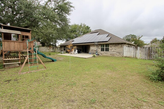 view of yard with a patio area and a playground