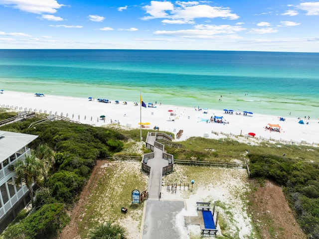 birds eye view of property featuring a water view and a view of the beach