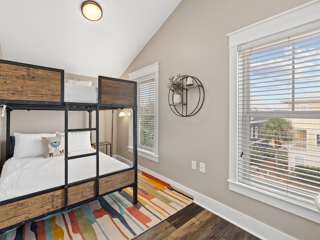 bedroom with hardwood / wood-style floors and vaulted ceiling