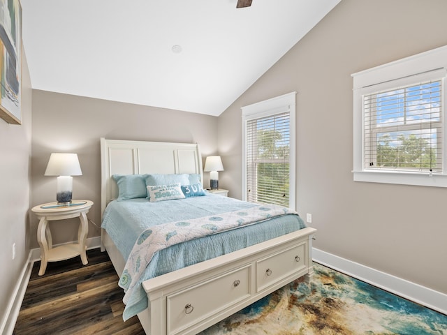 bedroom featuring dark wood-type flooring and vaulted ceiling