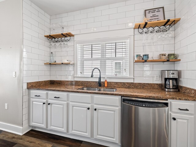 kitchen with dishwasher, dark hardwood / wood-style floors, white cabinetry, and sink