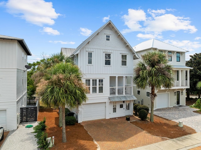 view of front of property with a garage and a balcony