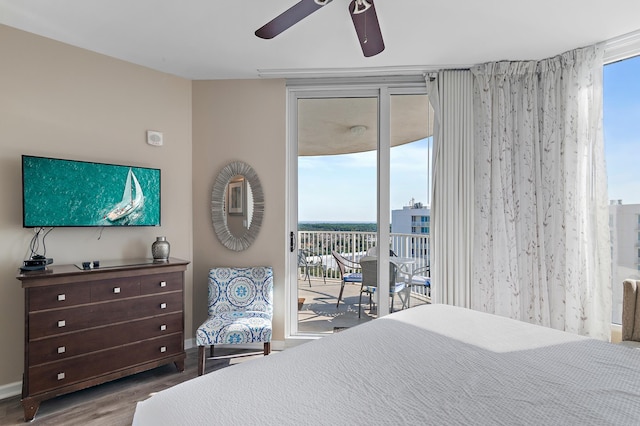 bedroom with ceiling fan, hardwood / wood-style floors, and access to exterior