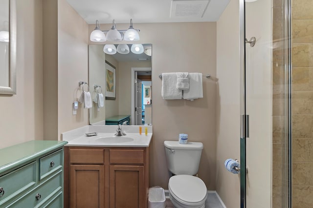 bathroom with an enclosed shower, vanity, and toilet