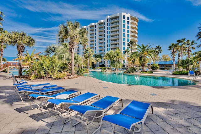 view of swimming pool featuring a patio area