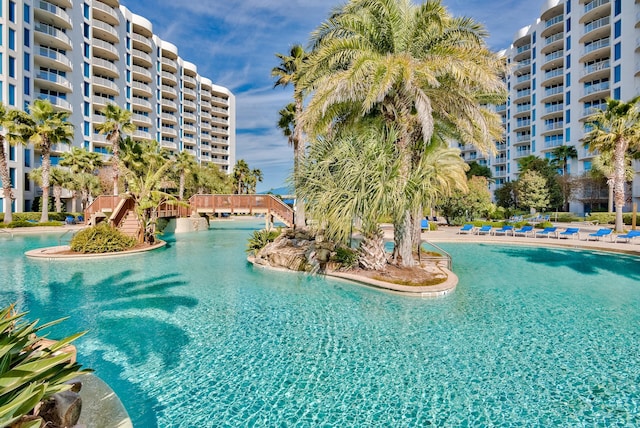 view of swimming pool featuring pool water feature