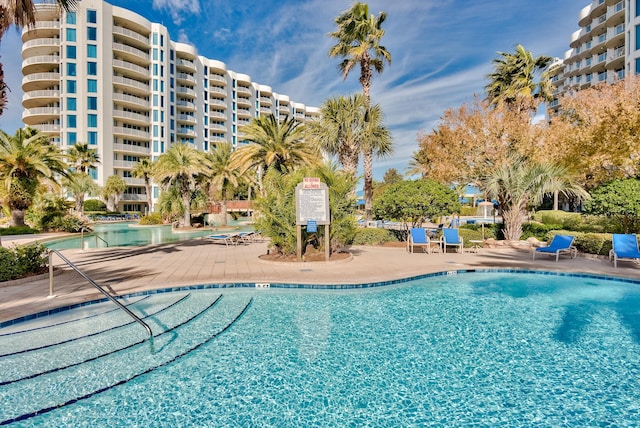 view of swimming pool with a patio area