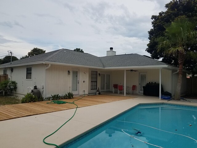 rear view of property with a patio area and a pool side deck