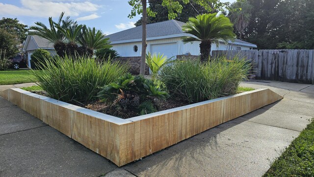 view of side of property with a garage