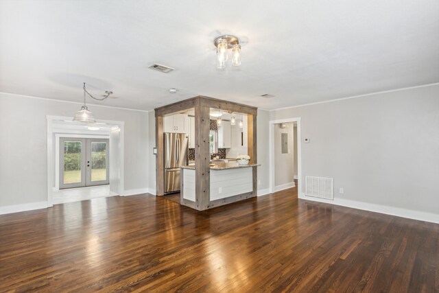 unfurnished living room with french doors, ornamental molding, and dark hardwood / wood-style flooring