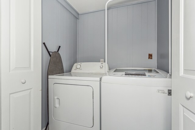 laundry area featuring washing machine and clothes dryer