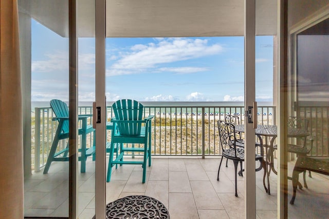 balcony featuring a water view