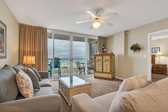 520 Santa Rosa Blvd Unit 301, Fort Walton Beach, FL 32548 - living room with carpet flooring, baseboards, expansive windows, and ceiling fan