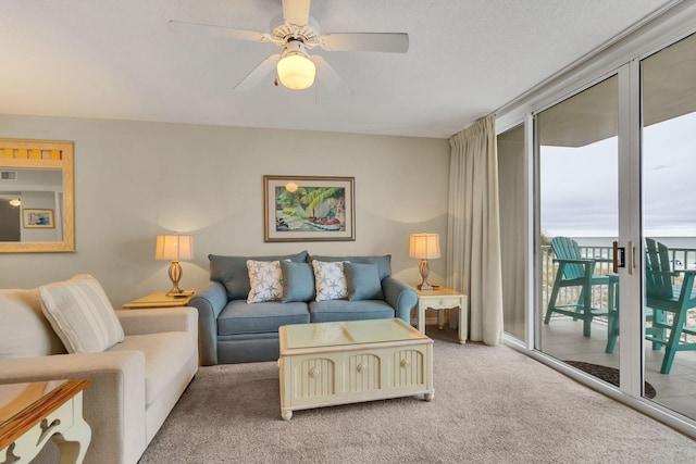 520 Santa Rosa Blvd Unit 301, Fort Walton Beach, FL 32548 - living room with a ceiling fan, visible vents, light colored carpet, and a wall of windows