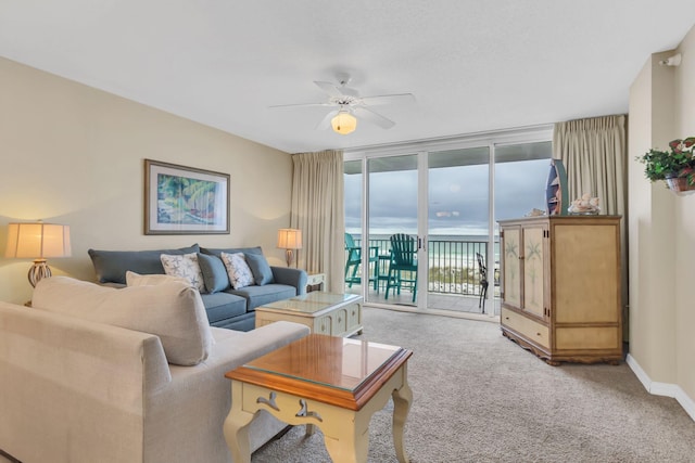 520 Santa Rosa Blvd Unit 301, Fort Walton Beach, FL 32548 - carpeted living room with baseboards, expansive windows, and a ceiling fan