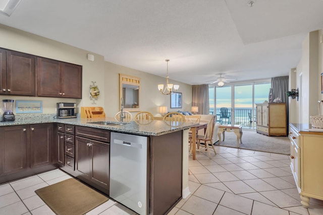 kitchen featuring ceiling fan with notable chandelier, dishwasher, kitchen peninsula, and sink