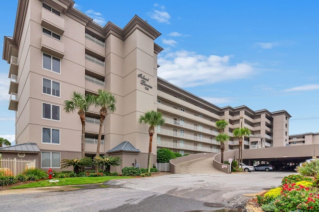 520 Santa Rosa Blvd Unit 301, Fort Walton Beach, FL 32548 - view of building exterior featuring covered parking