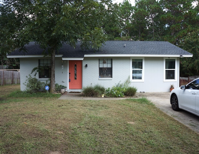 ranch-style house featuring a front lawn