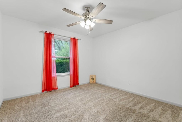 unfurnished room with carpet flooring and ceiling fan