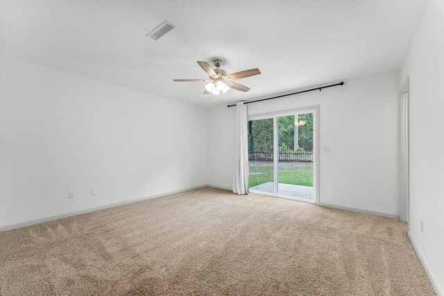 unfurnished room featuring ceiling fan and light carpet