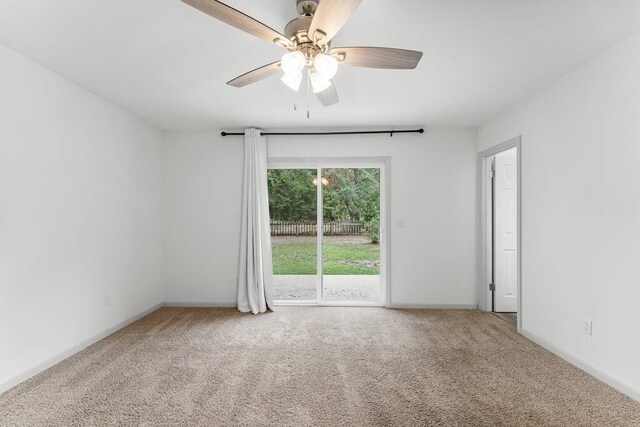 spare room with carpet flooring and ceiling fan