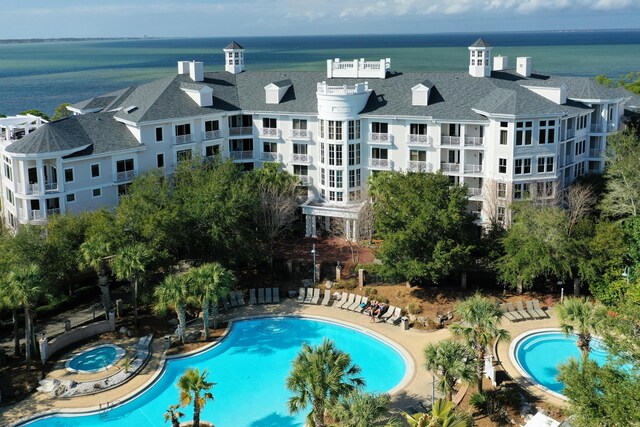 view of swimming pool featuring a water view