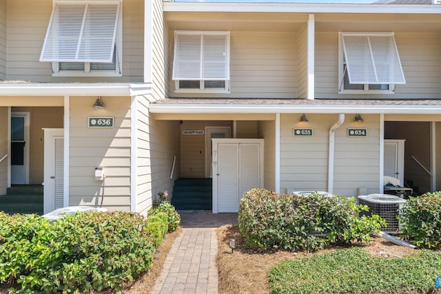 view of exterior entry featuring central AC