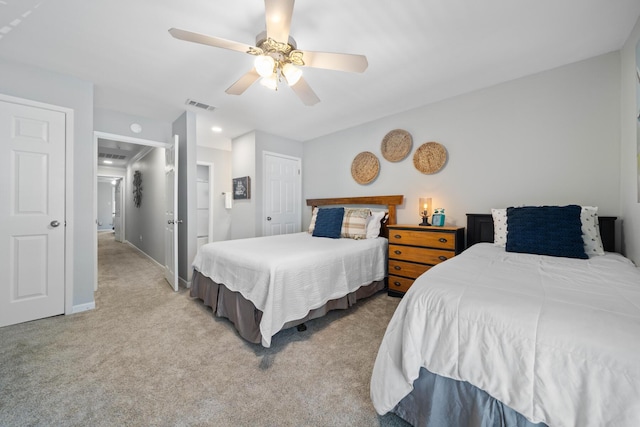 bedroom with light carpet and ceiling fan