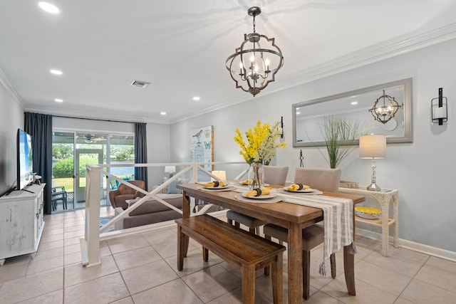 dining room with a chandelier, light tile patterned floors, and crown molding