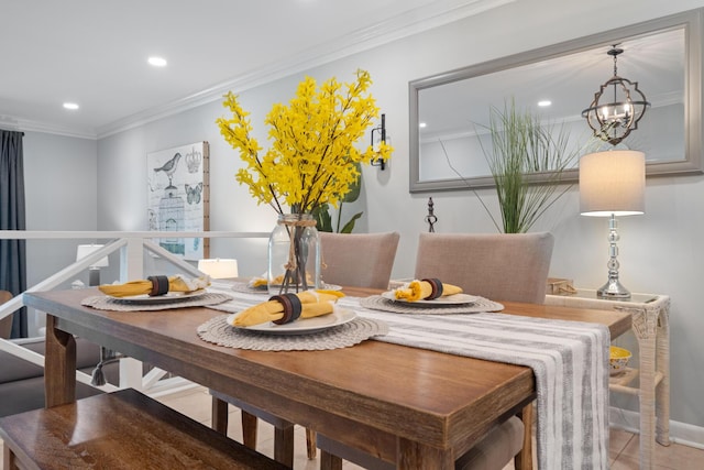 dining space featuring ornamental molding, light tile patterned floors, and a chandelier