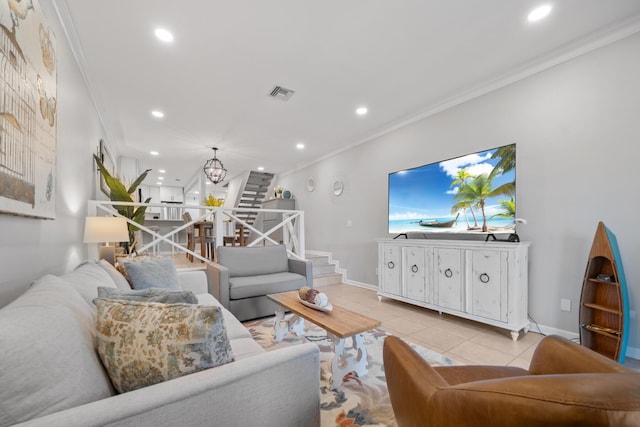 tiled living room with crown molding and a notable chandelier