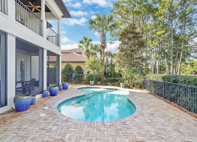 view of swimming pool featuring a patio area