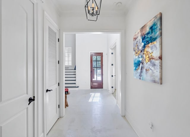 interior space with an inviting chandelier and crown molding