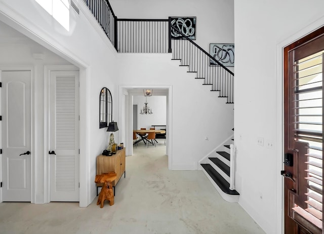 entrance foyer featuring a notable chandelier