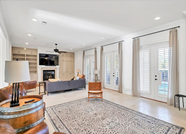 living room featuring ornamental molding, french doors, plenty of natural light, and ceiling fan