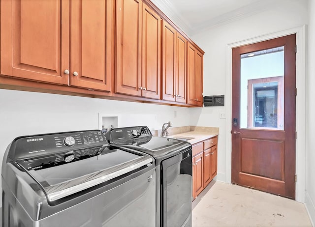 laundry area with washer and dryer, cabinets, ornamental molding, and sink