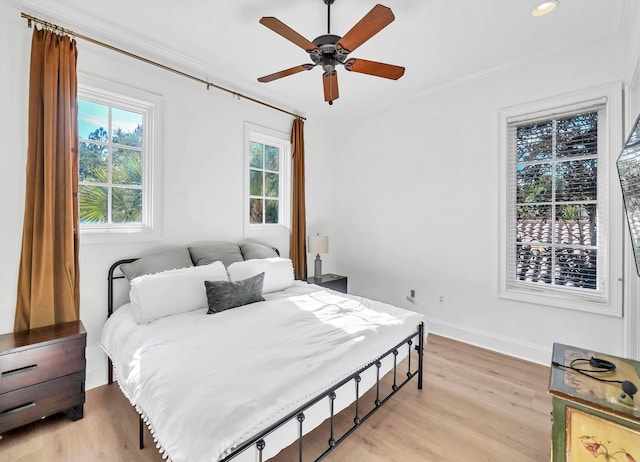 bedroom featuring ceiling fan and light hardwood / wood-style floors