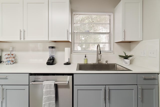 bar with dishwasher, white cabinetry, gray cabinets, and sink