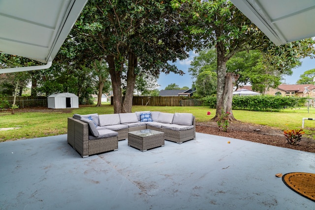 view of patio featuring an outdoor living space and a shed