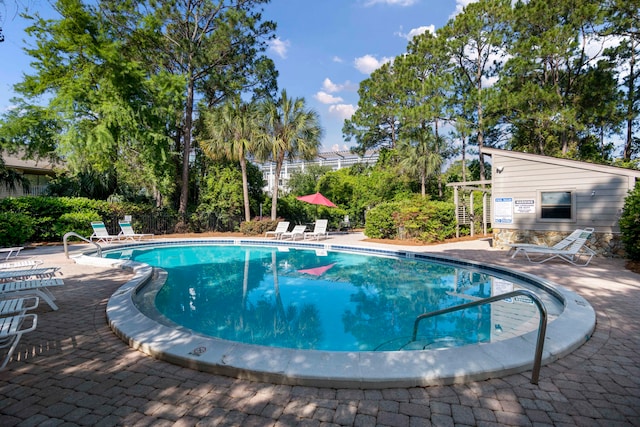 view of swimming pool with a patio