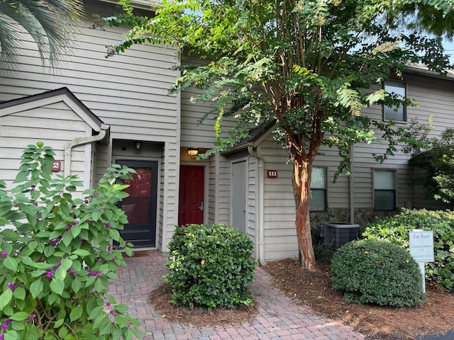 doorway to property featuring central AC