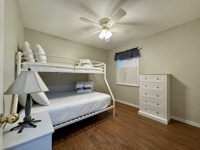 bedroom featuring ceiling fan and dark hardwood / wood-style flooring