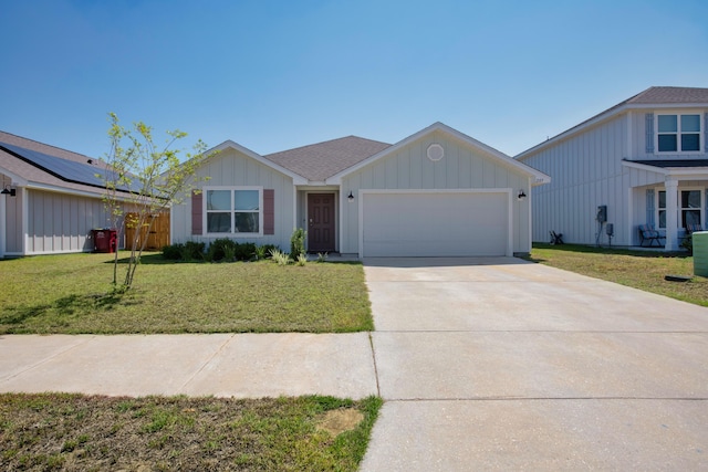 view of front of house with a front yard and a garage